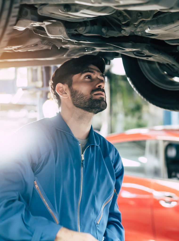 Mechanic looking under a vehicle - MOT Middlesbrough