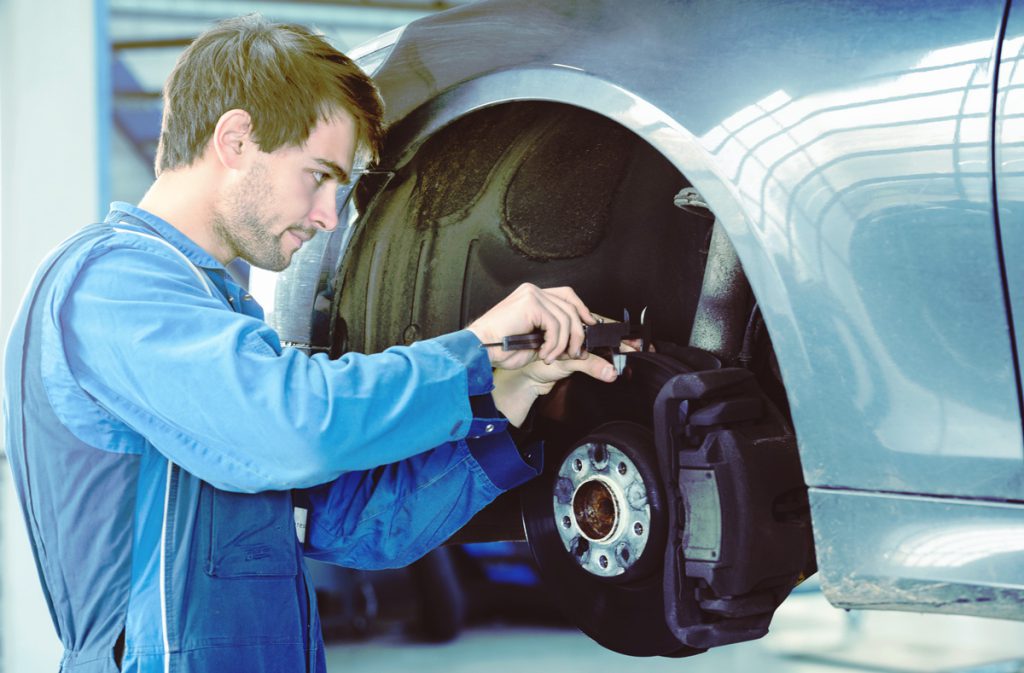 Mechanic changing vehicle brakes Middlesbrough